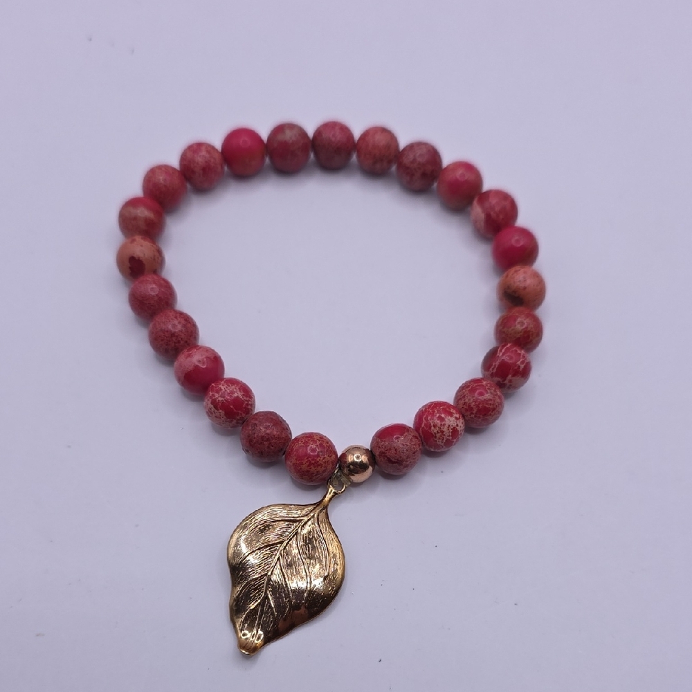 Red Imperial Jasper Stretch Beaded Bracelet with a Goldtone Leaf Charm